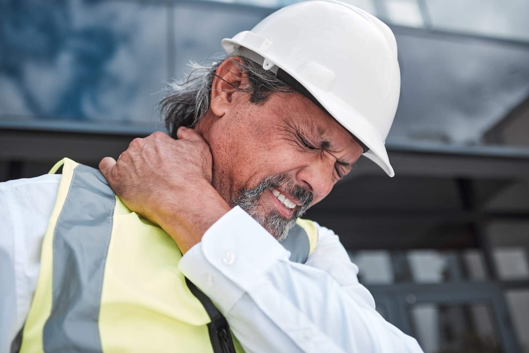 a man wearing a hard hat and safety vest