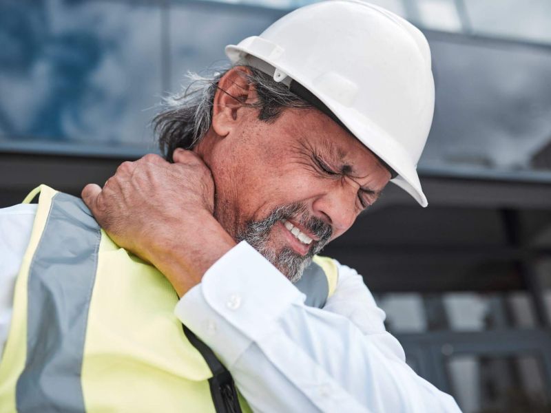 a man wearing a hard hat and safety vest