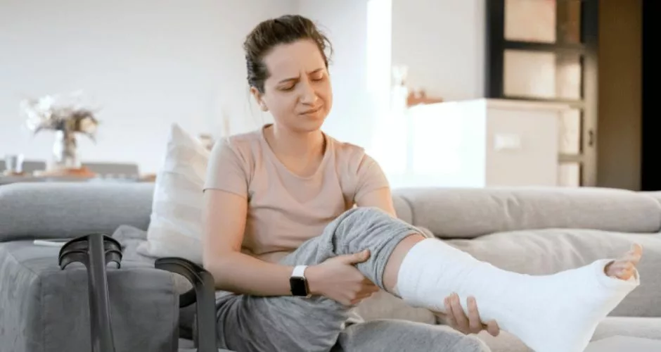 woman with a cast on leg caused by personal injury accident